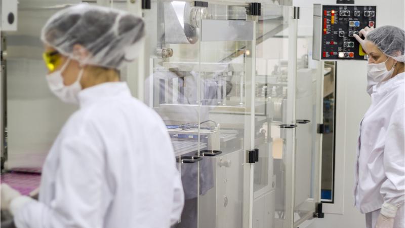Pharmaceuticals production line workers