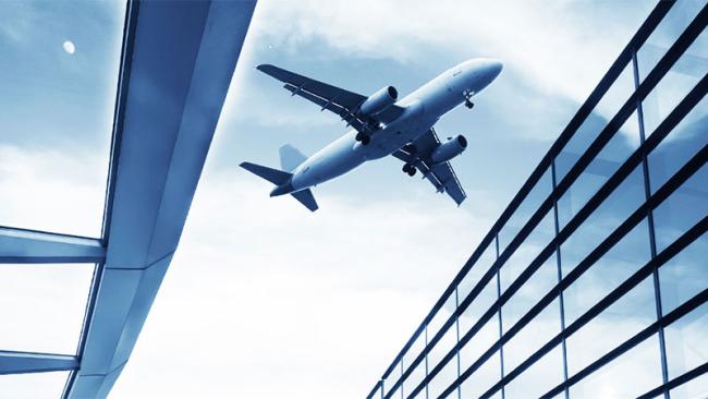 Airplane between buildings