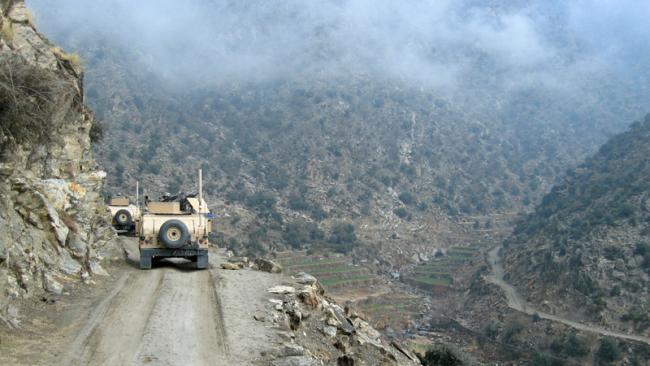 Military convoy on patrol in the desert.