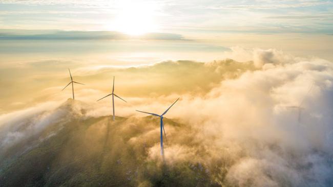 Wind turbines in mist