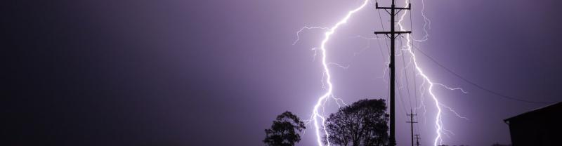 Lightning over power lines