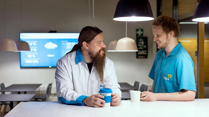Vaisala operations employees having coffee