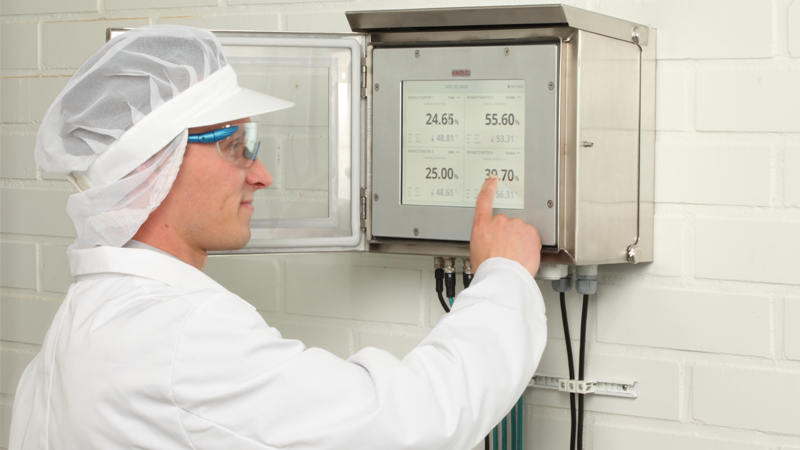 Process operator checking liquid measurement readings